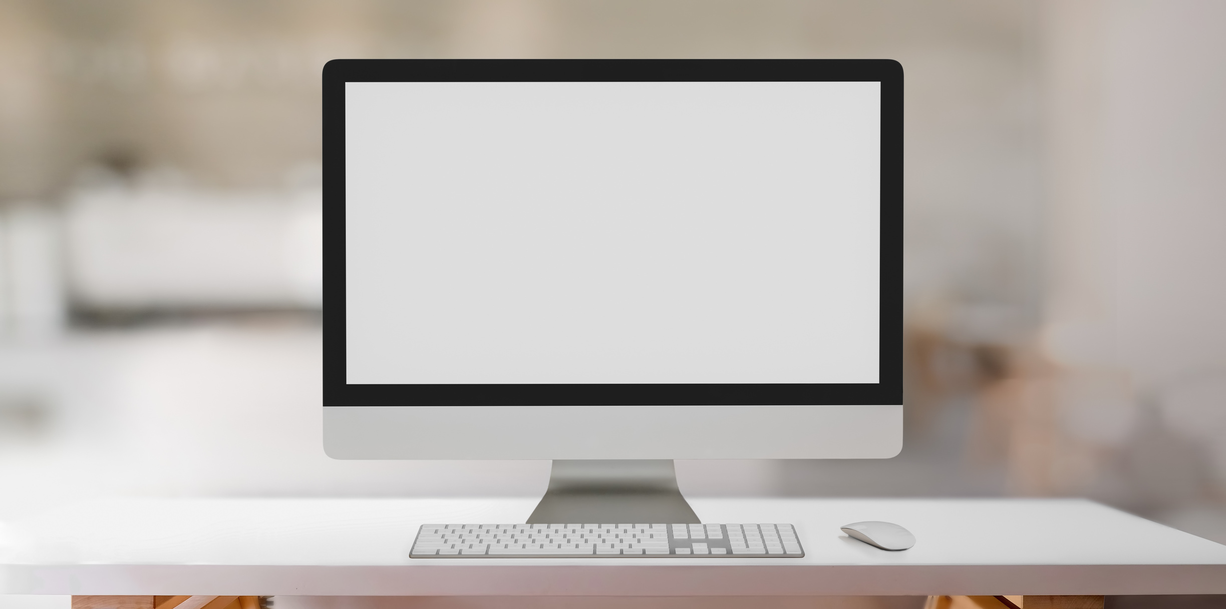 Computer placed on white table in creative workspace